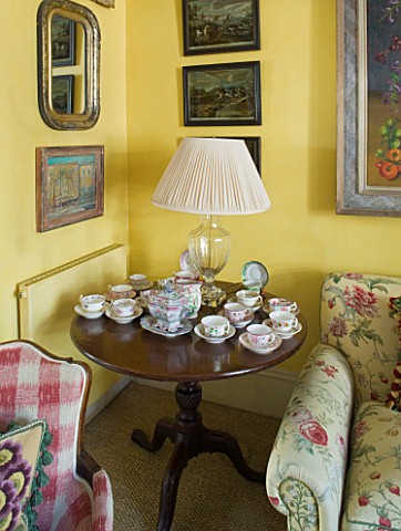DESIGNER_BUTTER_WAKEFIELD__LONDON__CORNER_OF_ROOM_WITH_WOODEN_TABLE_WITH_CUPS_AND_SAUCERS