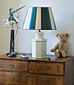 DESIGNER BUTTER WAKEFIELD  LONDON - WOODEN SIDEBOARD I N CHILDRENS BEDROOM WITH LAMP  TEDDY BEAR AND TOY CARDS