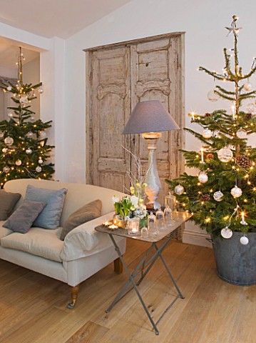 DESIGNER_JACKY_HOBBS__LONDON_LIVING_ROOM_AT_CHRISTMAS__SOFA__FAUX_FRENCH_DOORS__CHRISTMAS_TREES
