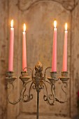 DESIGNER: JACKY HOBBS  LONDON: THE LIVING ROOM AT CHRISTMAS - CANDLES ON METAL CANDLE HOLDER