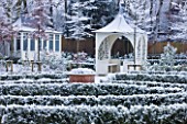 FORMAL TOWN GARDEN IN SNOW  OXFORD  WINTER: DESIGN BY LIZ NICHOLSON - SUMMERHOUSE AND GAZEBO/ ARBOUR WITH LOW BOX EDGED BEDS