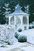 FORMAL TOWN GARDEN IN SNOW  OXFORD  WINTER: DESIGN BY LIZ NICHOLSON - ARBOUR/ GAZEBO  BOX HEGDING  HYDRANGEA ANNABELLE AND HORNBEAMS - CARPINUS BETULUS