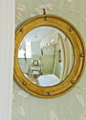 BRUERN COTTAGES  OXFORDSHIRE: CHRISTMAS - THE TWIN BEDROOM -  A CONVEX MIRROR ACTS AS A FISH-EYE LENS  GIVING A PICTURE OF THE ENTIRE BEDROOM