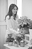 BLACK AND WHITE IMAGE OF STYLIST JACKY HOBBS AT HOME