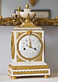 DESIGNER JANE CHURCHILL : ANTIQUE FRENCH CLOCK ABOVE FIREPLACE IN DRAWING ROOM
