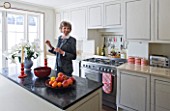 DESIGNER JANE CHURCHILL : JANE CHURCHILL LIGHTS A CANDLE IN THE KITCHEN