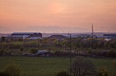 TEESSIDE  UNITED KINGDOM - PHOTO AT DUSK SHOWING WIND TURBINES IN THE DISTANCE