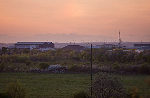 TEESSIDE__UNITED_KINGDOM__PHOTO_AT_DUSK_SHOWING_WIND_TURBINES_IN_THE_DISTANCE