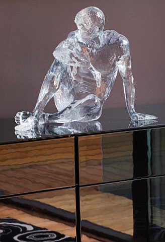 CAKE_BOY_HOUSE__LONDON_ICE_SCULPTURE_MADE_OF_GLASS__BY_SCULPTOR_BRUCE_DENNY__ON_A_CHEST_OF_DRAWERS_I