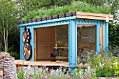 CHELSEA 2011 - RBC NEW WILD GARDEN DESIGNED BY NIGEL DUNNETT - GARDEN OFFICE/ STUDIO WITH GREEN ROOF MADE FROM A REFURBISHED SHIPPING CONTAINER