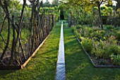 LE JARDIN DALCHIMISTE  PROVENCE  FRANCE: DESAIGNERS ARNAUD MAURIERES AND ERIC OSSART - RILL WITH LIVING WILLOW FENCES AND LAWN