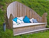 DESIGNER CLARE MATTHEWS - DECKING PROJECT - THE THRONE - DECK SEAT SET INTO HILLSIDE WITH BLUE AND WHITE CUSHIONS
