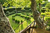 LES CONFINES  PROVENCE  FRANCE - DESIGNER: DOMINIQUE LAFOURCADE: TIMBER AND IRONWORK STAIRWAY TO VIEWING PLATFORM IN PLANE TREE AND VIEW OF CLIPPED EVERGREENS IN LAWN