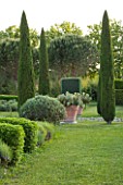 LES CONFINES  PROVENCE  FRANCE - DESIGNER: DOMINIQUE LAFOURCADE - CLIPPED CYPRESSES - CUPRESSUS SEMPERVIRENS - AND TERRACOTTA CONTAINERS WITH OPUNTIA CACTUS
