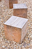 DECKING PROJECT - DESIGNER: CLARE MATTHEWS - SQUARE WOODEN BLOCKS IN GRAVEL USED AS SEATING
