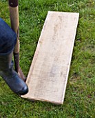 DECKING PROJECT - DESIGNER: CLARE MATTHEWS - PUTTING WOODEN BOARD INTO LAWN AS A STEPPING STONE