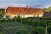 PRIEURE NOTRE-DAME DORSAN  FRANCE: THE PRIORY WITH THE CLOISTER OF GREENERY IN FRONT