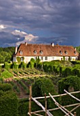 PRIEURE NOTRE-DAME DORSAN  FRANCE: THE PRIORY WITH VINEYARD IN THE CLOISTER OF GREENERY