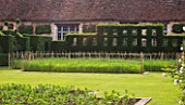 PRIEURE NOTRE-DAME DORSAN  FRANCE: LAWN  WHEAT MEADOW AND TOPIARY HEDGE