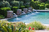 DESIGNER DOMINIQUE LAFOURCADE  PROVENCE  FRANCE: SWIMMING POOL WITH FOUR BRICK FOUNTAINS THAT SPURT RECYCLED WATER