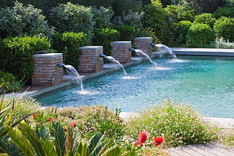 DESIGNER_DOMINIQUE_LAFOURCADE__PROVENCE__FRANCE_SWIMMING_POOL_WITH_FOUR_BRICK_FOUNTAINS_THAT_SPURT_R