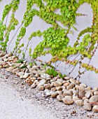 DESIGNER DOMINIQUE LAFOURCADE  PROVENCE  FRANCE: WALL WITH STONES BESIDE IT