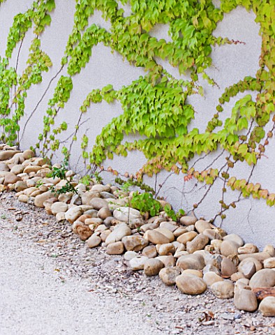 DESIGNER_DOMINIQUE_LAFOURCADE__PROVENCE__FRANCE_WALL_WITH_STONES_BESIDE_IT