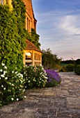 WHATLEY MANOR  WILTSHIRE: VIEW OF THE HOTEL WITH LAVENDER  AT SUNSET