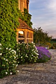 WHATLEY MANOR  WILTSHIRE: VIEW OF THE HOTEL WITH LAVENDER  AT SUNSET