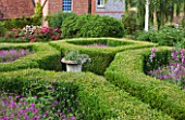 HHOOK END FARM  BERKSHIRE: THE BOX PARTERRE WITH GERANIUM PATRICIA  ALLIUMS AND PERENNIAL SWEET PEAS WITH FARMHOUSE BEHIND