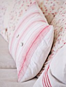 AMANDA KNOX HOUSE  GRANTHAM: THE LIVING ROOM - LINEN SOFA WITH VINTAGE QUILTS AND HOME MADE CUSHIONS