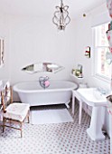 AMANDA KNOX HOUSE  GRANTHAM: WHITE BATHROOM - TRADITIONAL ROLL TOP BATH  MIRROR PANEL ENGRAVED WITH AMANDA KNOXS INITIALS  ROSE PRINTED FLOOR TILES FROM KATH KIDSTON