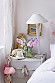 AMANDA KNOX HOUSE  GRANTHAM: WHITE BEDROOM - PAINTED BEDSIDE TABLE FROM ARDINGLY ANTIQUE FAIR  WITH OLD TELEPHONE AND TEDDY BEAR