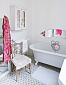 AMANDA KNOX HOUSE  GRANTHAM:WHITE KITCHEN WITH TRADITIONAL ROLL TOP BATH  MIRROR PANEL ENGRAVED WITH AMANDAS INITIALS  ROSE PRINTED FLOOR TILES FROM IKEA