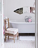 AMANDA KNOX HOUSE  GRANTHAM: WHITE BATHROOM WITH TRADITIONAL ROLL TOP BATH  CATH KIDSTON ROSE PATTERNED TILE FLOORING  VINTAGE CHAIR SEAT  MIRROR