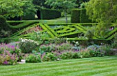 ASTHALL MANOR  OXFORDSHIRE: PARTERRE ON SLOPE PLANTED WITH ALLIUMS AND ANNUALS IN SUMMER