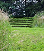 ASTHALL MANOR  OXFORDSHIRE: TURF STEPS LEADING UP TO THE SWIMMING POOL
