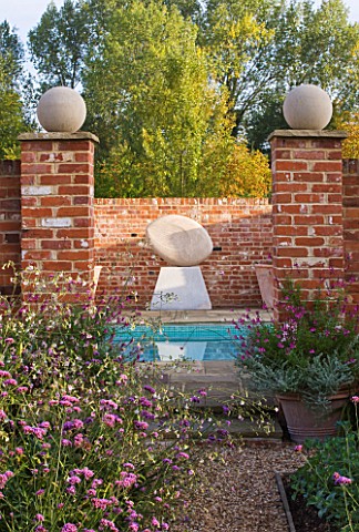 ULTING_WICK__ESSEX__VIEW_TO_SWIMMING_POOL_WITH_SCULPTURE_ANCASTER_ANGEL_BY_DOMINIC_WELCH