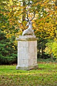 SALING HALL  ESSEX: STONE STAGE SCULPTURE SURROUNDED BY AUTUMN COLOURS