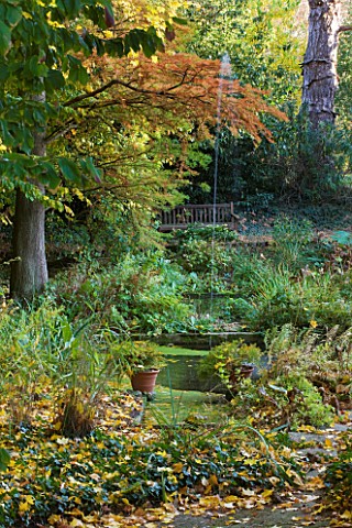 SALING_HALL__ESSEX_THE_WATER_GARDEN_IN_AUTUMN_WITH_TWO_SHALLOW_PONDS_AND_A_SINGLE_JET_OF_WATER