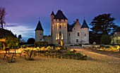 CHATEAU DU RIVAU  LOIRE VALLEY  FRANCE: VIEW OF THE CHATEAU LIT UP AT NIGHT WITH THE POTAGER IN THE FOREGROUND