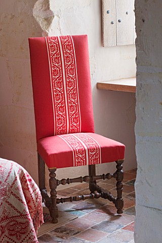 CHATEAU_DU_RIVAU__LOIRE_VALLEY__FRANCE_RED_THEMED_BEDROOM__RED_CHAIR_BY_WINDOW