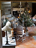 ROQUELIN  LOIRE VALLEY  FRANCE: VIEW FROM DINING ROOM TO SITTING ROOM WITH CHRISTMAS TREE AT THE FOOT OF WOODEN STAIRCASE