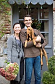 ROQUELIN  LOIRE VALLEY  FRANCE: OWNERS ALINE AND STEPHANE CHASSINE OUTSIDE THEIR RENOVATED FARMHOUSE WITH THEIR YOUNG DOG GARONNE