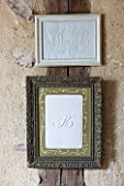 ROQUELIN  LOIRE VALLEY  FRANCE: SEWING ROOM; FRAMED VINTAGE FRENCH MONOGRAMS ON LINEN