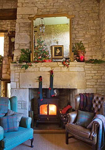FULBROOK_HOUSE_GALLERIED_MAIN_HALL_WITH_COTSWOLD_STONE_FIREPLACE__LOG_BURNING_STOVE_AND_LEATHER_AND_