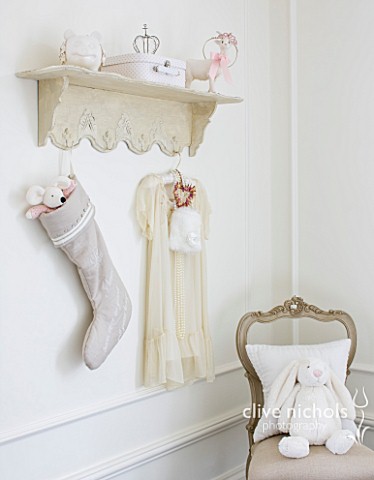 WHITE_HOUSE_GIRLS_BEDROOM__DECORATIVE_SHELF_HUNG_WITH_LINEN_CHRISTMAS_STOCKING_AND_PRETTY_DRESS