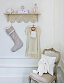 WHITE HOUSE: GIRLS BEDROOM - DECORATIVE SHELF HUNG WITH LINEN CHRISTMAS STOCKING AND PRETTY DRESS