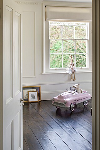 WHITE_HOUSE_GIRLS_BEDROOM__PINK_OLD_STYLE_PEDAL_CAR_WITH_TEDDY