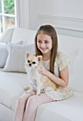 WHITE HOUSE: GIRL WITH PET DOG IN LIVING ROOM